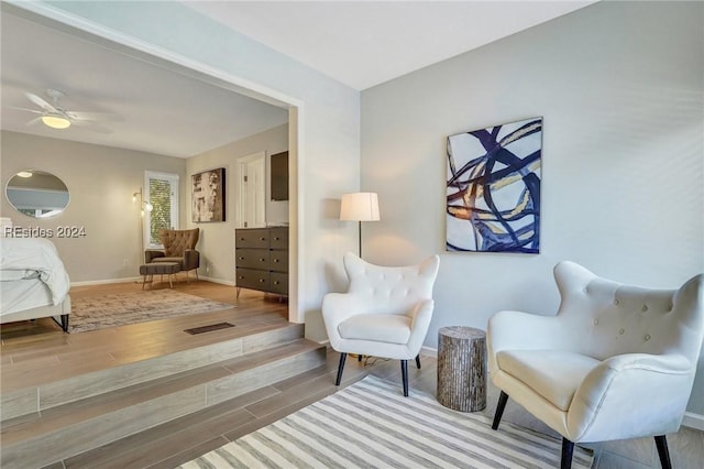 living area featuring ceiling fan