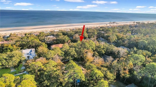 drone / aerial view with a water view and a beach view