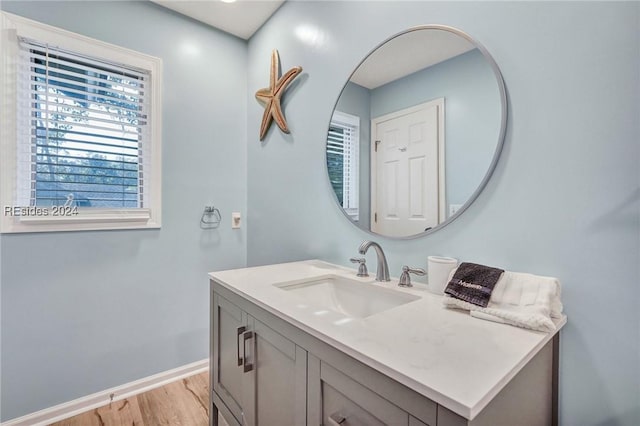 bathroom featuring vanity and hardwood / wood-style flooring