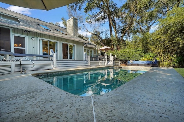 view of swimming pool featuring a patio area