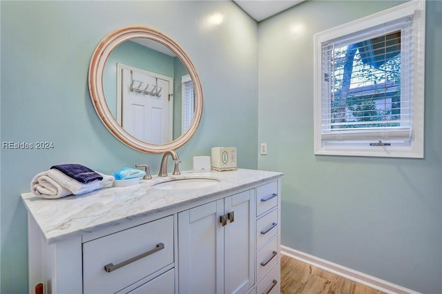 bathroom featuring vanity and wood-type flooring