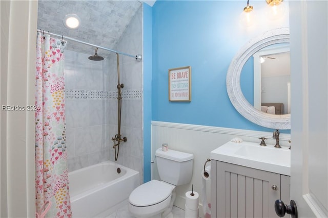 full bathroom featuring vanity, shower / tub combo with curtain, and toilet