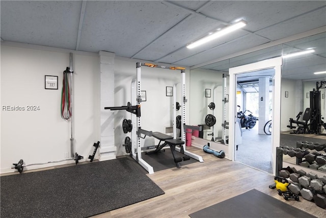 exercise room featuring hardwood / wood-style floors