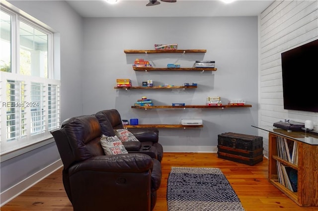 sitting room featuring hardwood / wood-style flooring and plenty of natural light