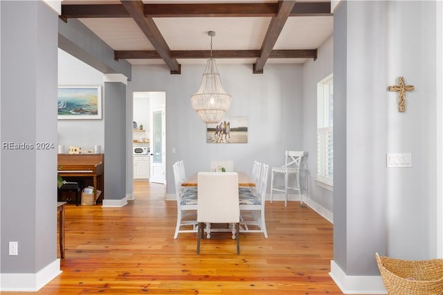 dining area featuring beamed ceiling and hardwood / wood-style floors