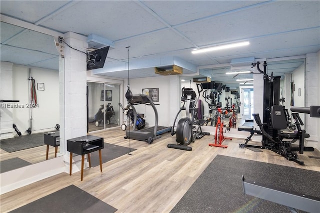 gym with hardwood / wood-style floors