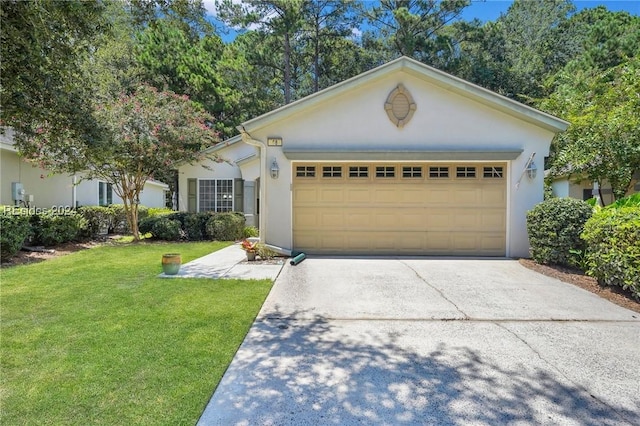 ranch-style home with a garage and a front lawn