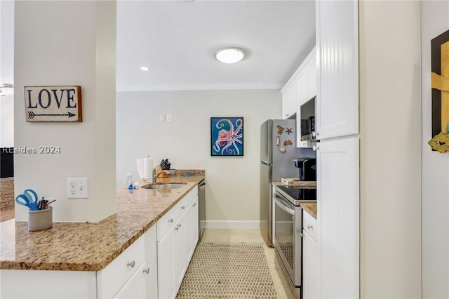 kitchen featuring light stone countertops, appliances with stainless steel finishes, sink, and white cabinets