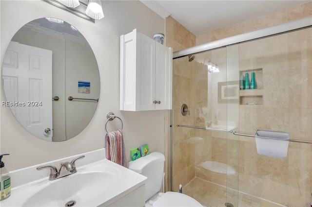 bathroom with ornamental molding, toilet, an enclosed shower, and sink