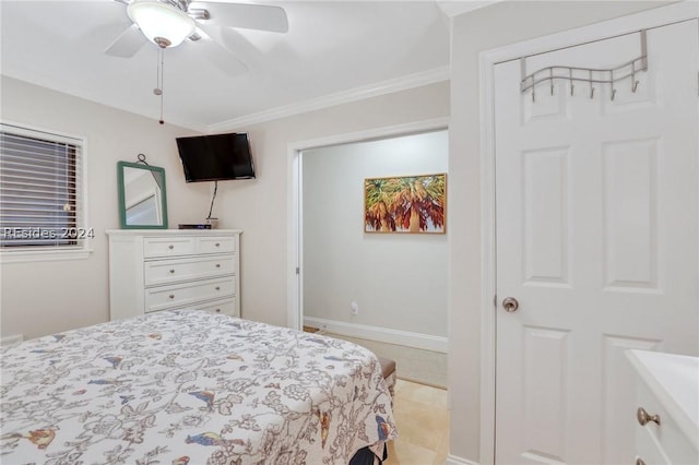 bedroom with ornamental molding and ceiling fan