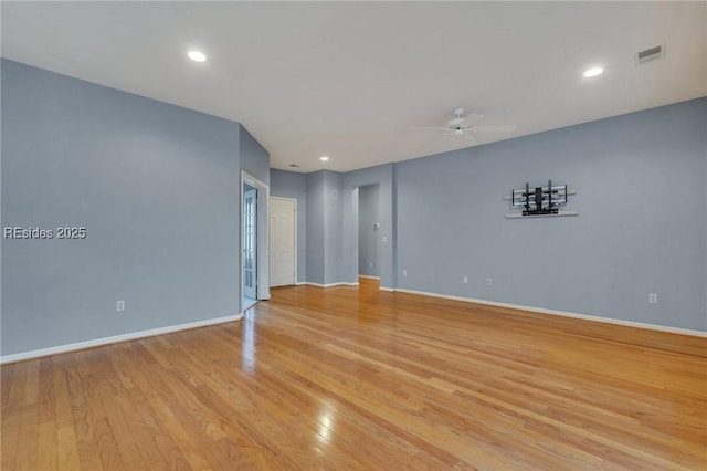 unfurnished room featuring ceiling fan and light hardwood / wood-style flooring