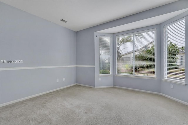 empty room featuring light colored carpet