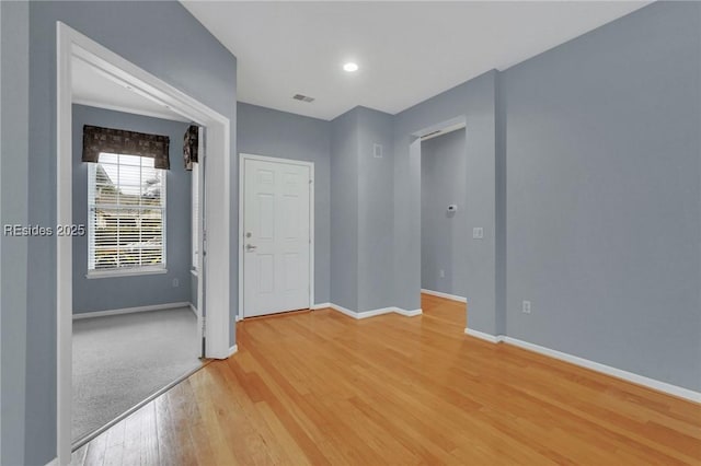 empty room with light hardwood / wood-style floors