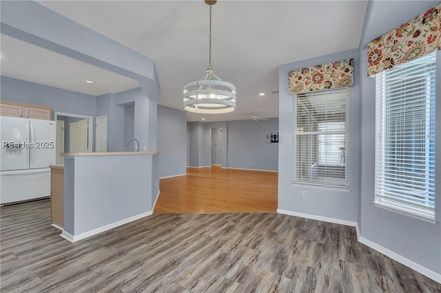 interior space featuring hardwood / wood-style flooring, sink, and a chandelier