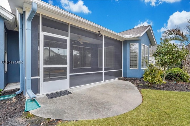 rear view of property with a sunroom and a yard