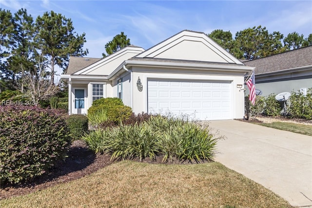 single story home with a garage and a front yard