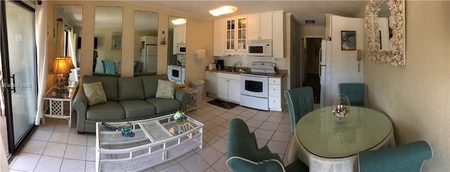 tiled living room featuring sink