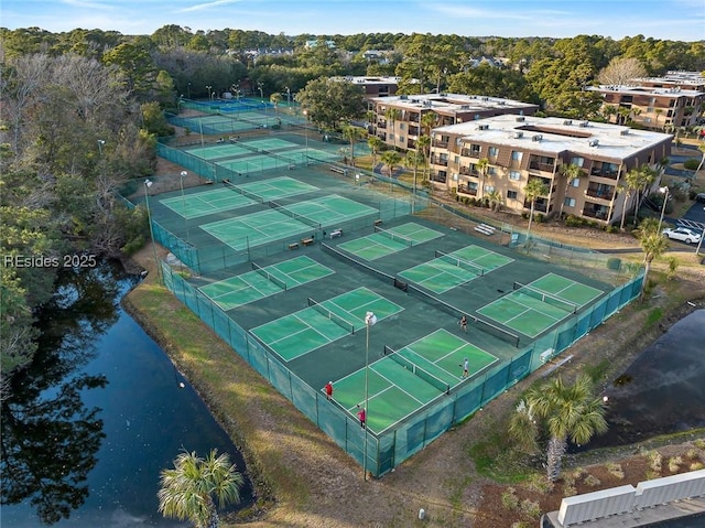 birds eye view of property with a water view