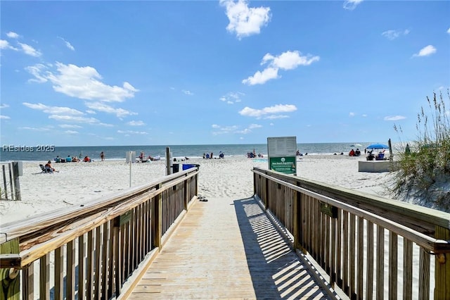 view of home's community featuring a view of the beach and a water view