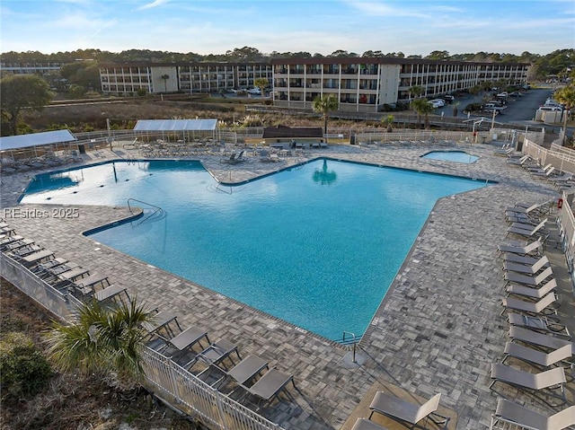 view of swimming pool with a patio area