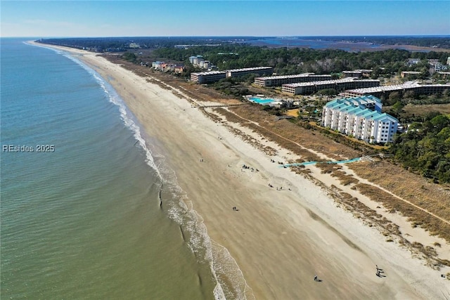 bird's eye view featuring a view of the beach and a water view