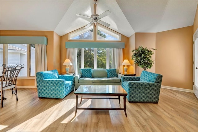 sunroom with ceiling fan, vaulted ceiling, and a wealth of natural light