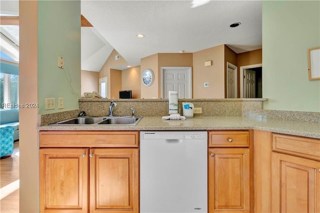 kitchen featuring sink, light hardwood / wood-style flooring, dishwasher, light stone countertops, and kitchen peninsula