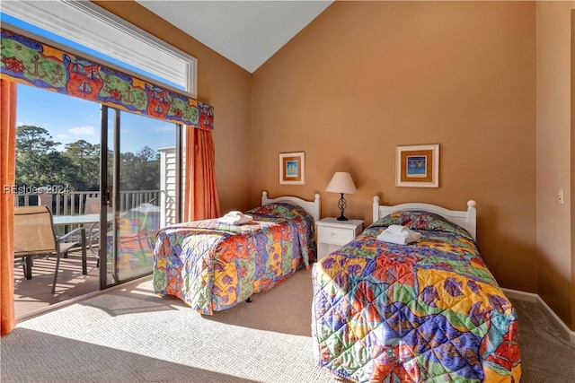 bedroom with lofted ceiling, carpet flooring, and access to exterior