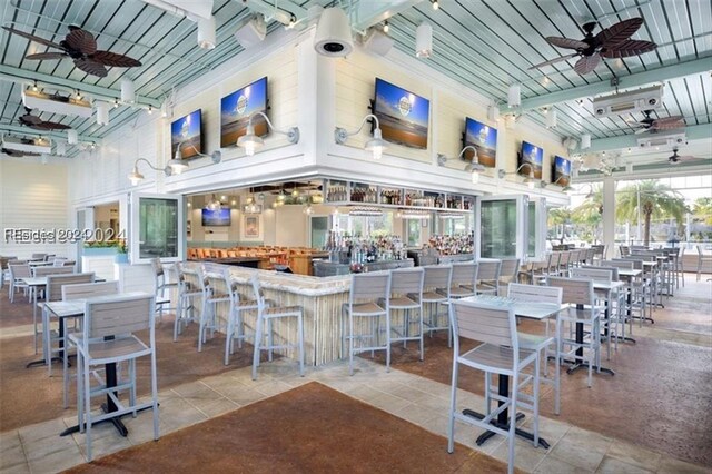 view of patio with an outdoor bar and ceiling fan