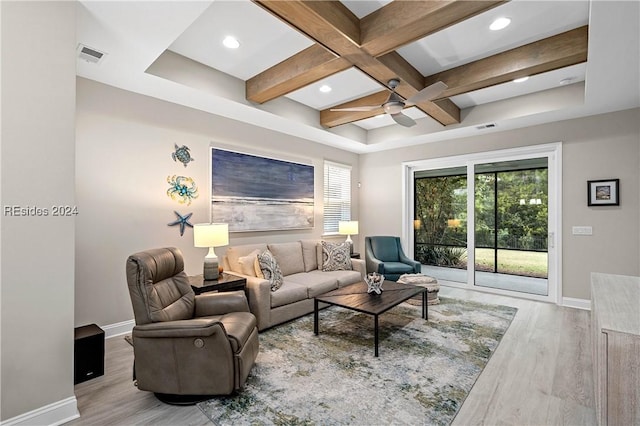 living room featuring beamed ceiling, ceiling fan, coffered ceiling, and light hardwood / wood-style floors