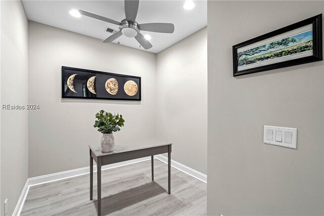 office space featuring ceiling fan and light hardwood / wood-style flooring