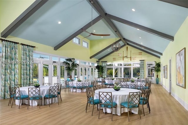 dining space featuring beamed ceiling, ceiling fan, high vaulted ceiling, and light hardwood / wood-style flooring