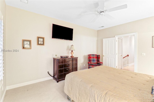 bedroom with light carpet and ceiling fan