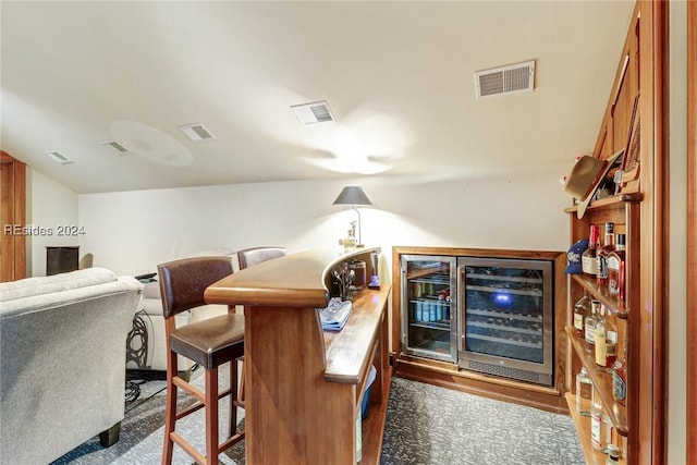 bar featuring beverage cooler