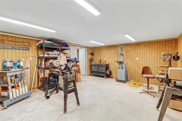 interior space with wooden walls and a workshop area