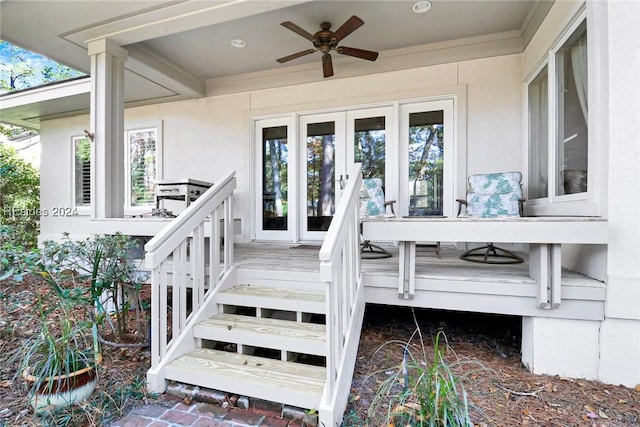 view of exterior entry featuring ceiling fan