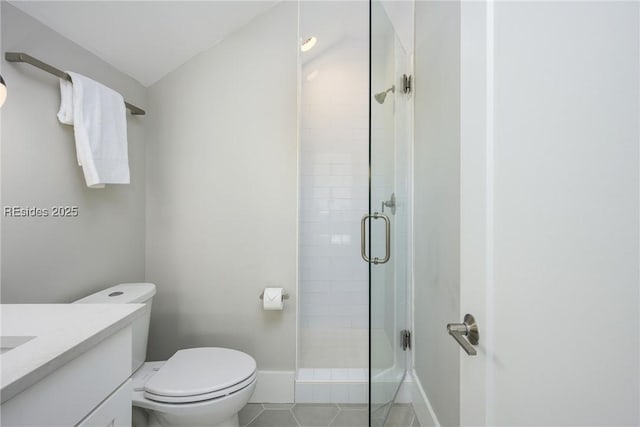 bathroom featuring tile patterned floors, toilet, an enclosed shower, and vanity