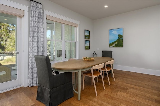 dining area featuring hardwood / wood-style flooring