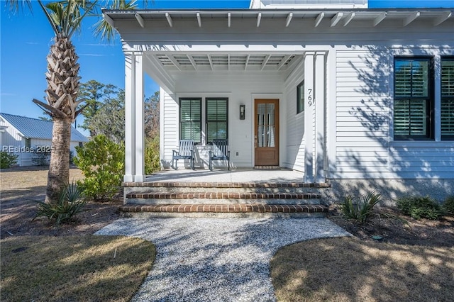 property entrance with covered porch