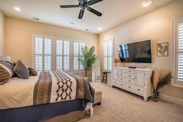 bedroom with light carpet and ceiling fan