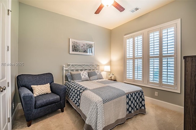 bedroom featuring light carpet and ceiling fan