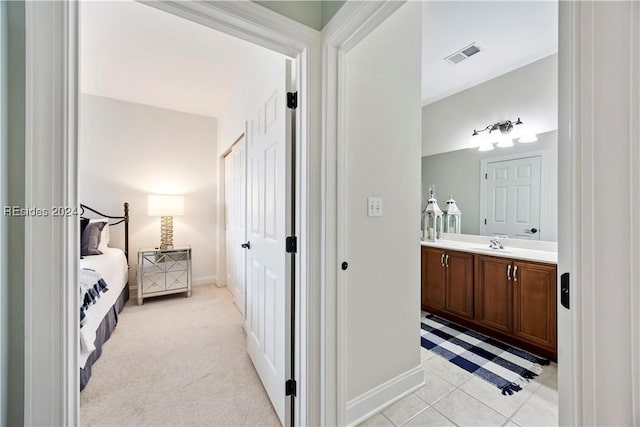 bathroom with vanity and tile patterned floors