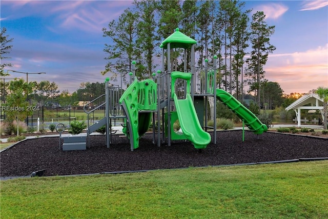 playground at dusk with a yard