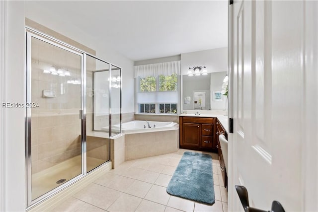 bathroom featuring vanity, independent shower and bath, and tile patterned flooring