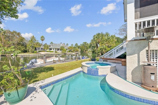 view of swimming pool featuring an in ground hot tub and a water view