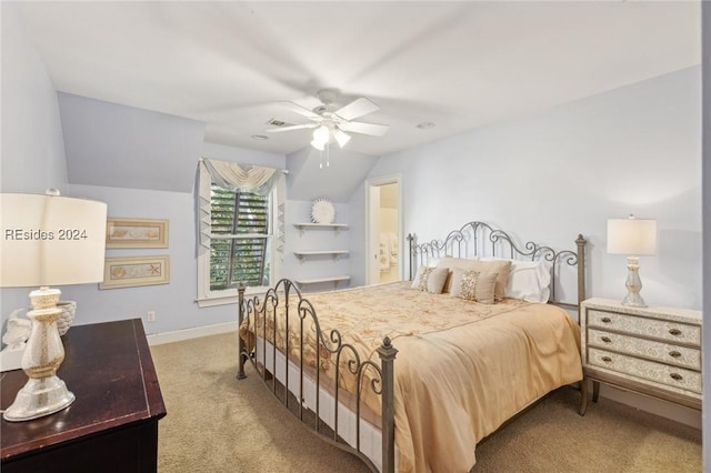 carpeted bedroom with lofted ceiling, ensuite bath, and ceiling fan