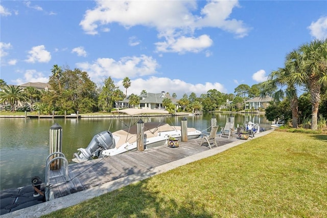 view of dock featuring a water view and a yard