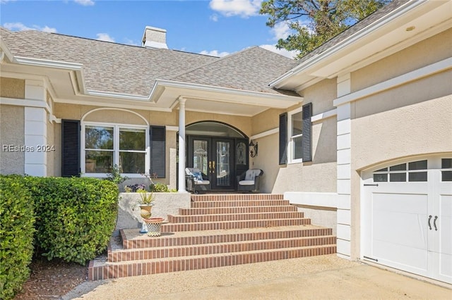 entrance to property featuring a garage