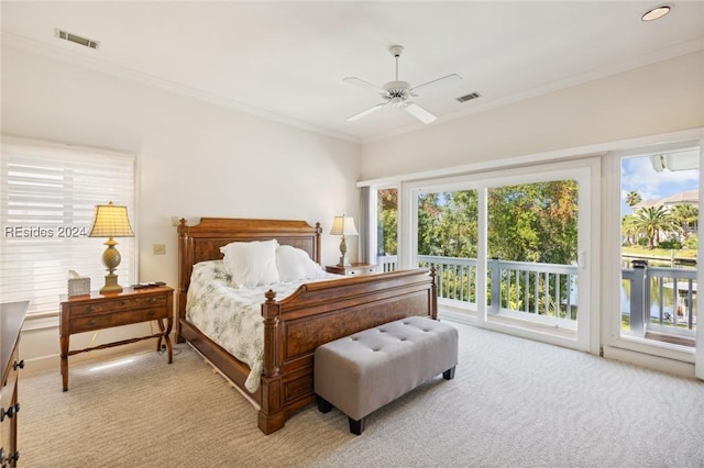 carpeted bedroom featuring ceiling fan, access to exterior, and multiple windows