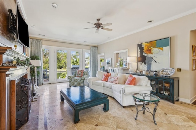 living room featuring ceiling fan and ornamental molding